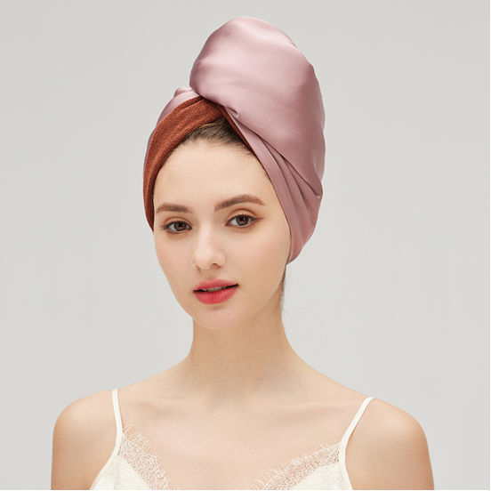 Model wearing a navy Jiasili silk bonnet